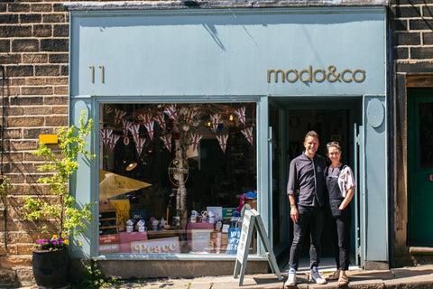 modo and co shop, founders standing outside in the sunshine on the village street