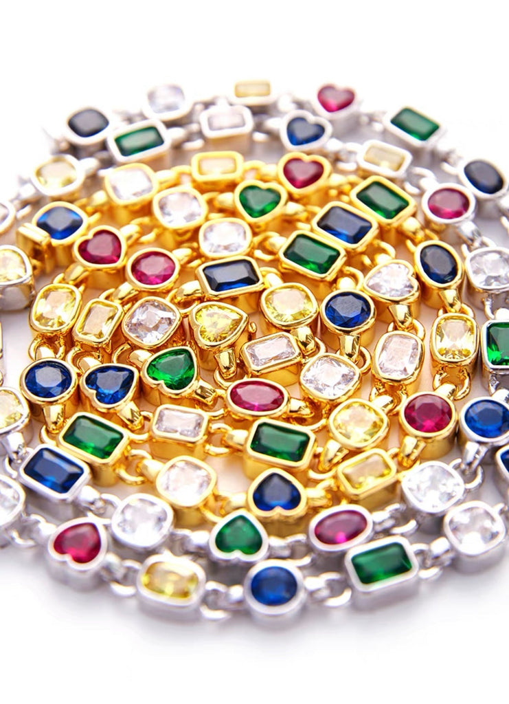 Pharrell Williams grills are studded with sapphires, rubies and emeralds. INFINITY GAUNTLETS jewelry diamond choker jacob & co short necklace gemstone heart Gabby Elan Jewelry infinity stone grillz grill grills