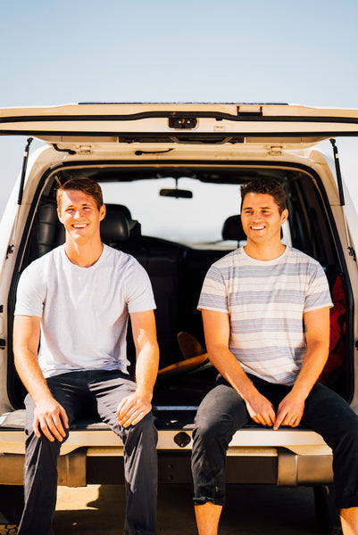 Founders Rory and Jeff sitting on the back of a land cruiser