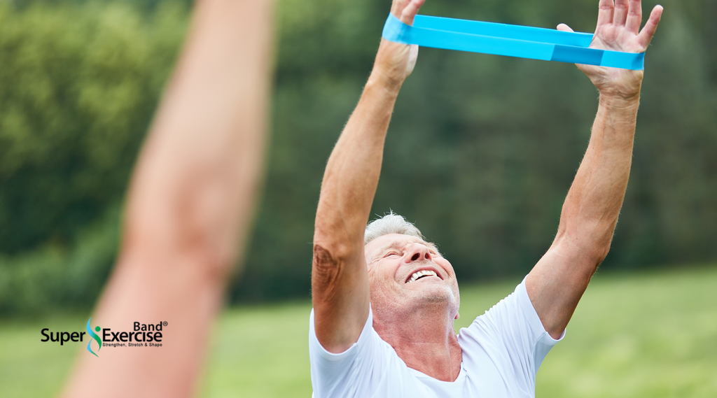 An elderly woman showcasing a Super Exercise Band for senior fitness.