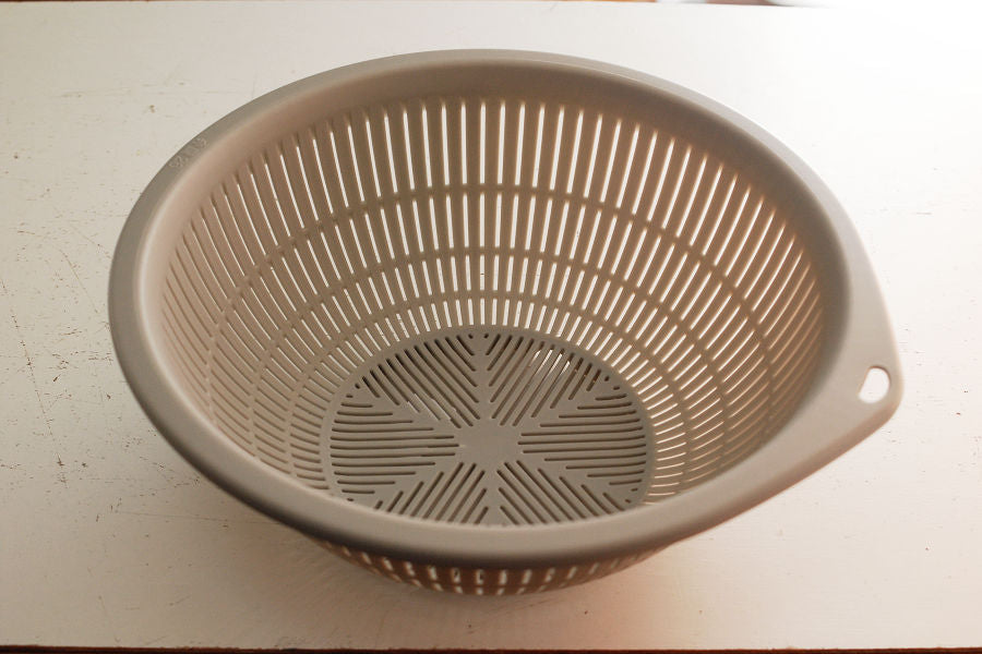 Lightweight and inexpensive plastic colander. 