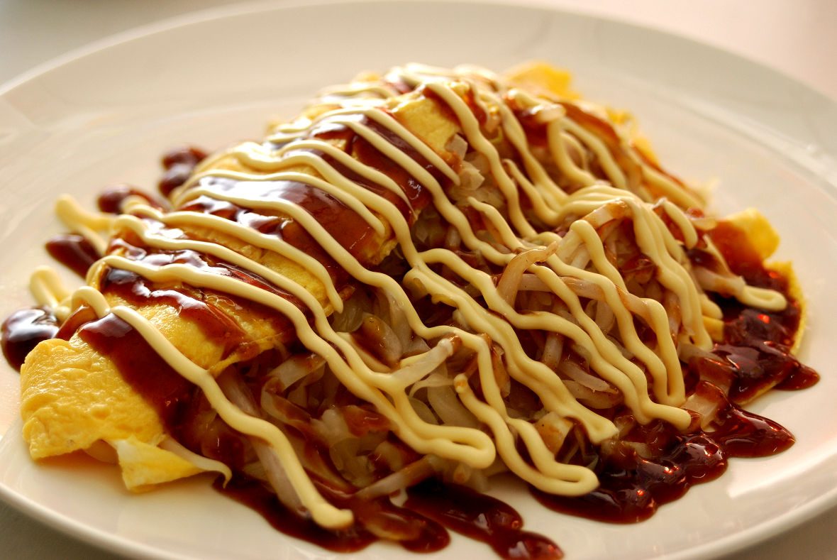 Tonpei Yaki is something similar to Okonomiyaki. It consists of stir-fried cabbage, 
bean sprouts, pork, etc. wrapped in flat thin omelette. It is eaten with Okonomiyaki sauce and mayonnaise.
