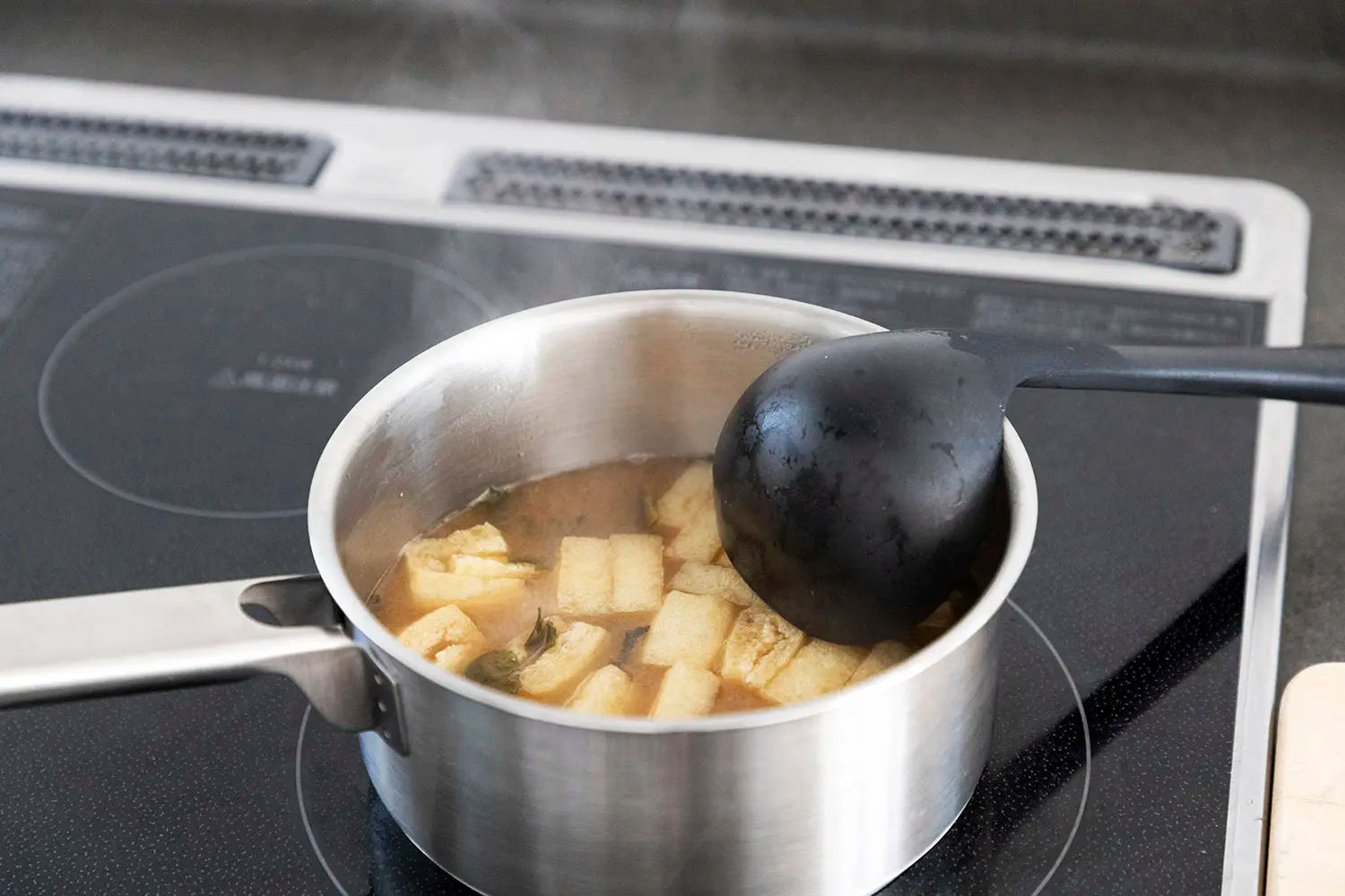 Adding miso to dashi