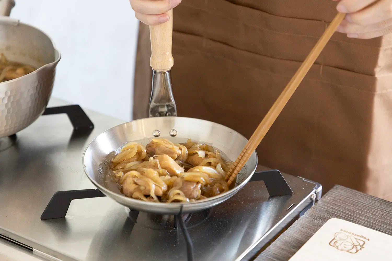 Chicken and onion in oyakodon pan