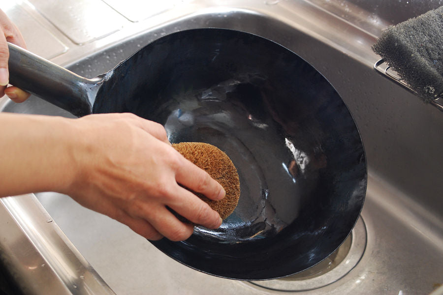 Use a Japanese Tawashi brush for washing because metal scourers may scratch the surface and cause rust.