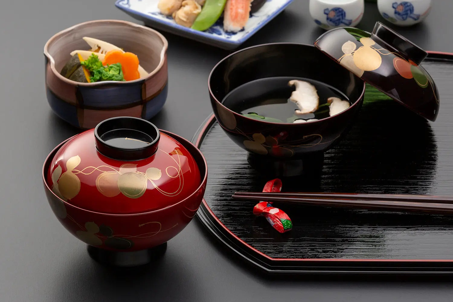 You can create an elegant Japanese style table with foods served on gorgeous lacquerware dishes, created by one of Japan's proud art crafts.