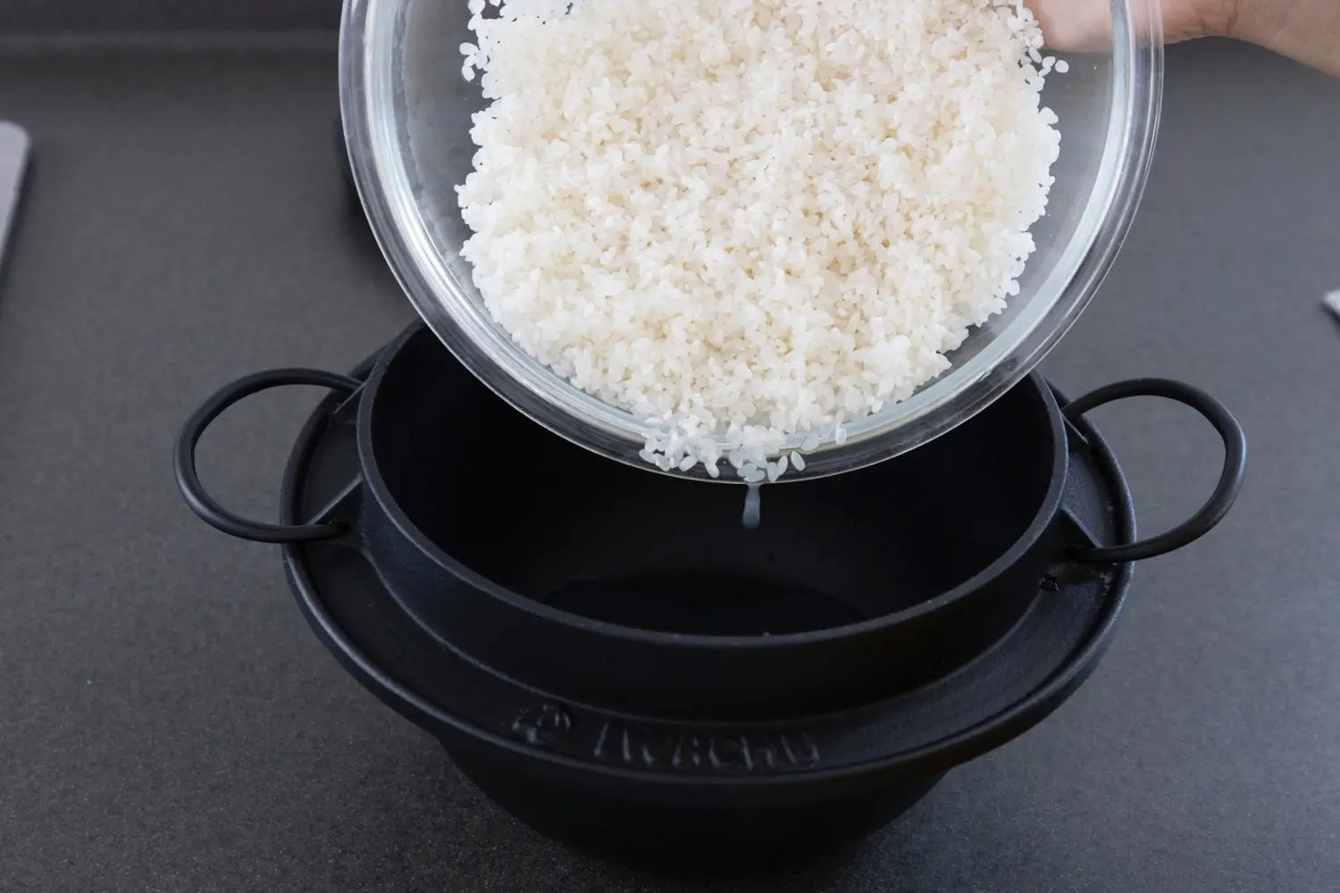 Pouring rice into the pot