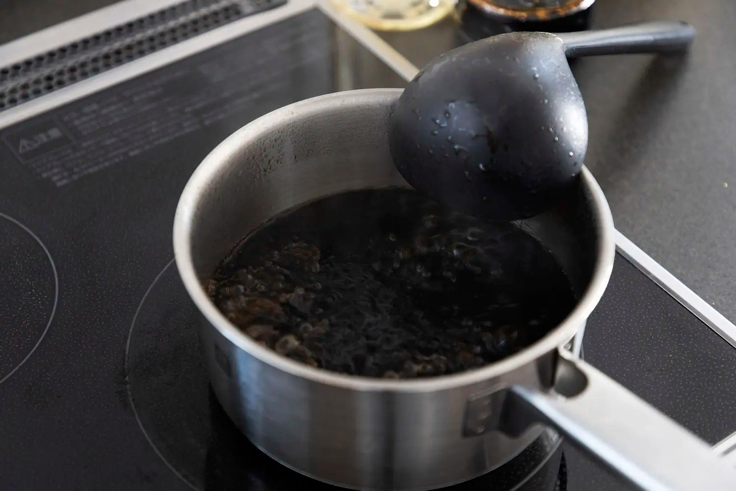 Sukiyaki broth boiling in pot