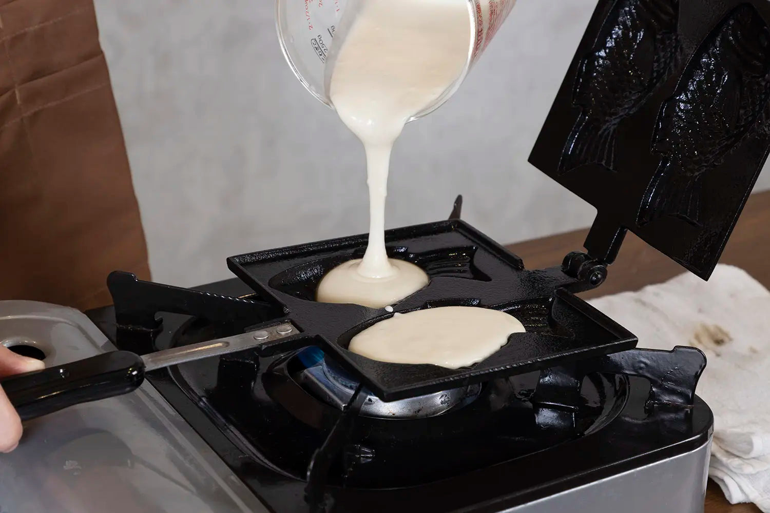 Pouring batter into the iron