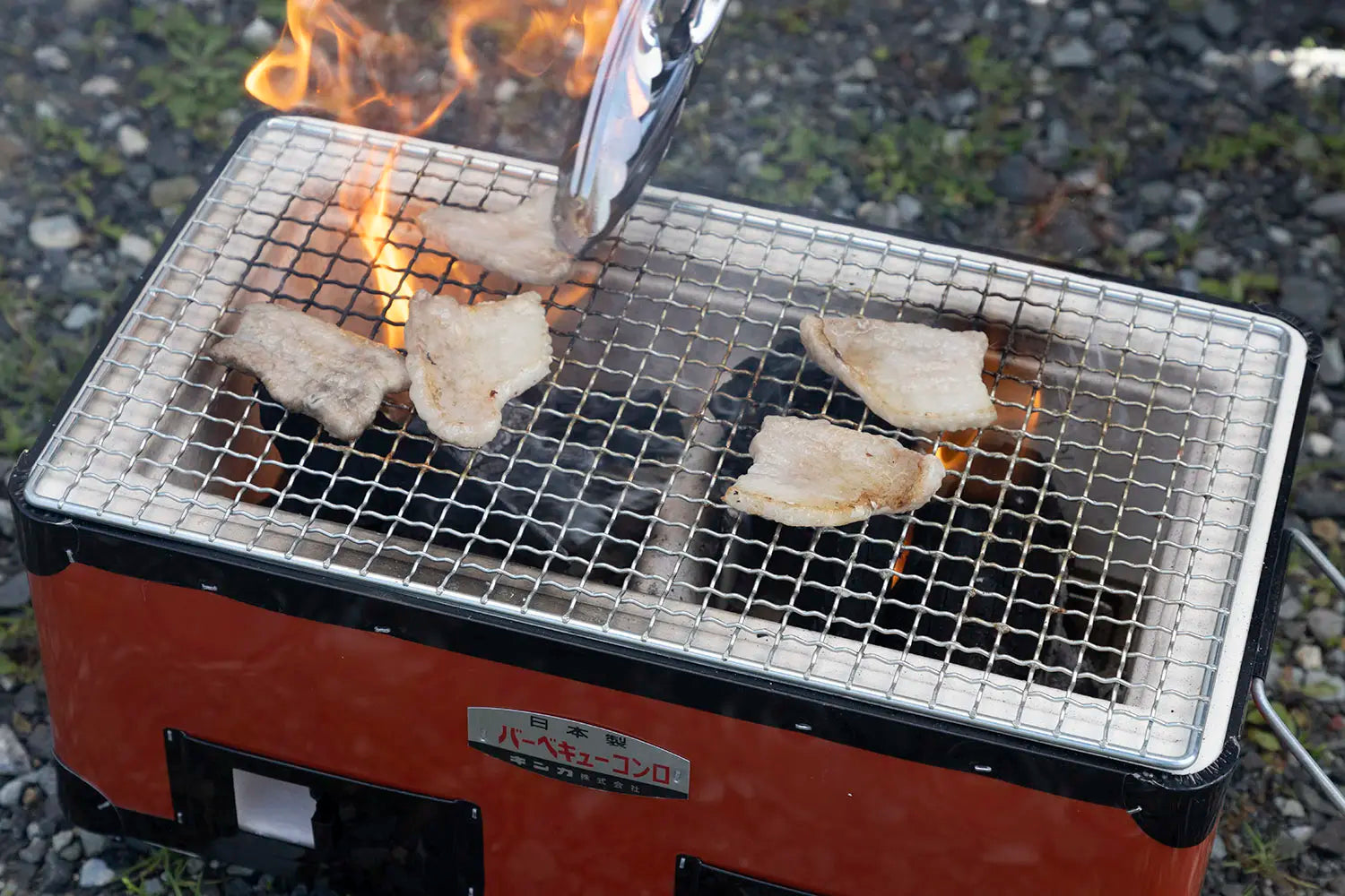 Greasing the grate with pork