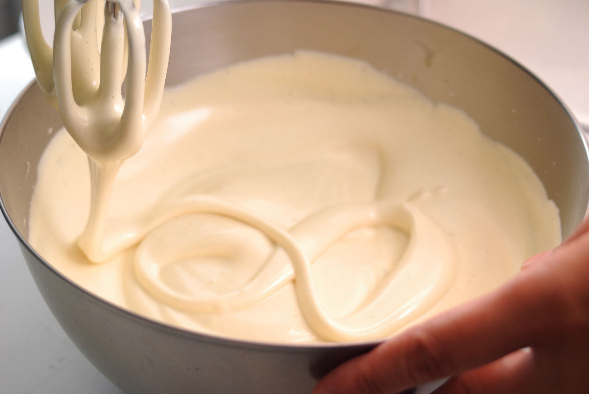 Keep mixing and whip the egg mixture with a handheld mixer.