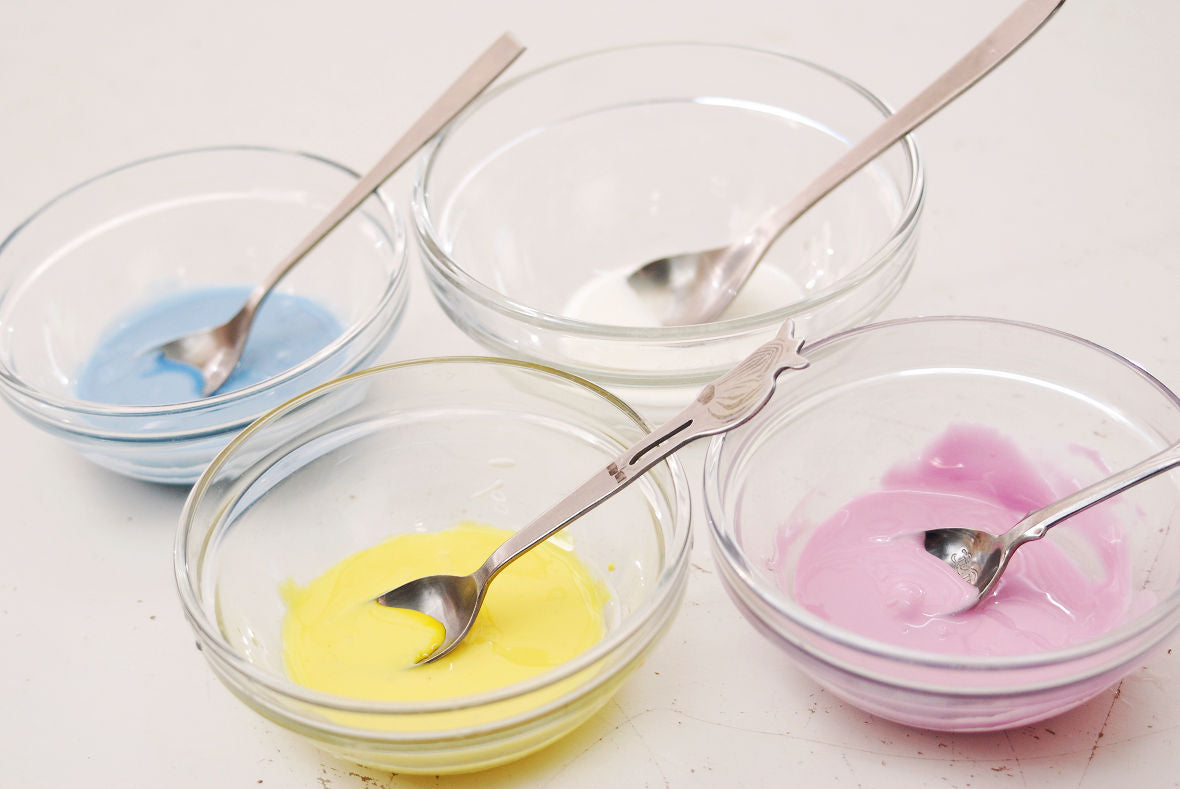 Mix diluted food coloring with royal icing to make color variety.