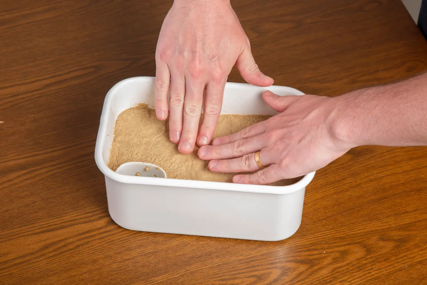 Use the remaining nukazuke to bury the vegetables. Make sure holes of the drainage bowl are near the top of the nukazuke mixture.