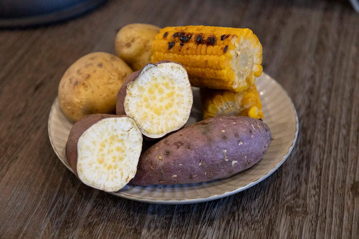 Roasted sweet potatoes, potatoes, and corn