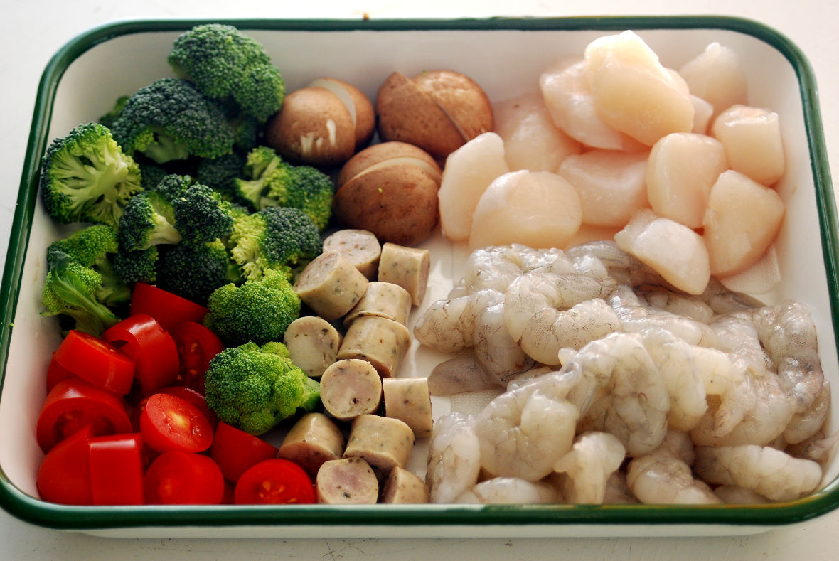 Cut the ingredients to the size that can fit in each hole of the Takoyaki pan.