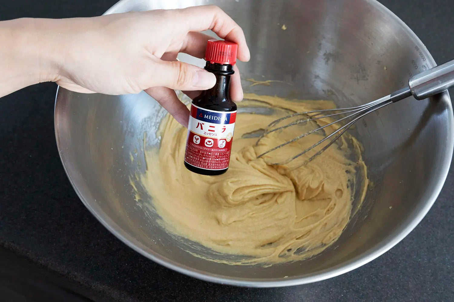 Adding vanilla essence to mixture
