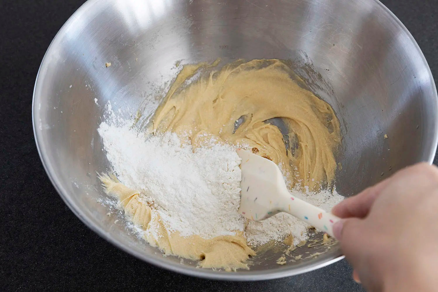 Adding flour to mixture