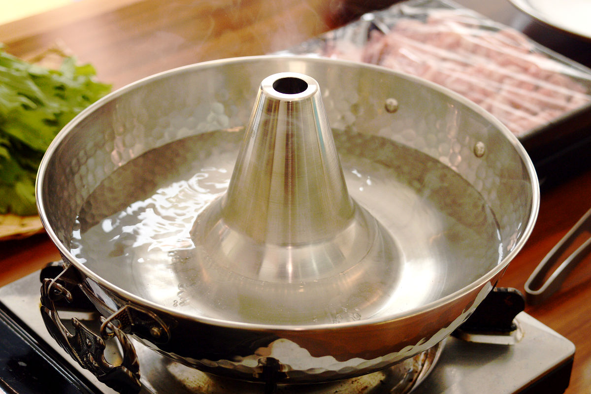 Shabu-shabu is a Japanese hot pot dish in which very thin bite-sized sliced pieces of meat are dipped in boiling water in a pot and served with Ponzu (soy sauce and citrus juices) or Gomadare (sesame sauce).