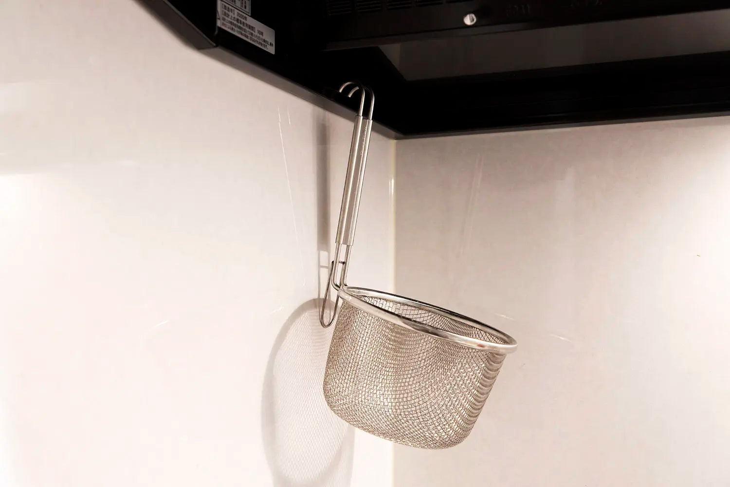 Three Snow Ramen Strainer Hanging in Kitchen