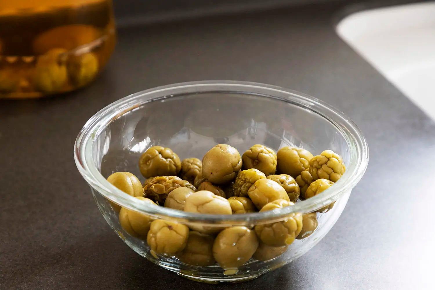 Plums in a glass bowl