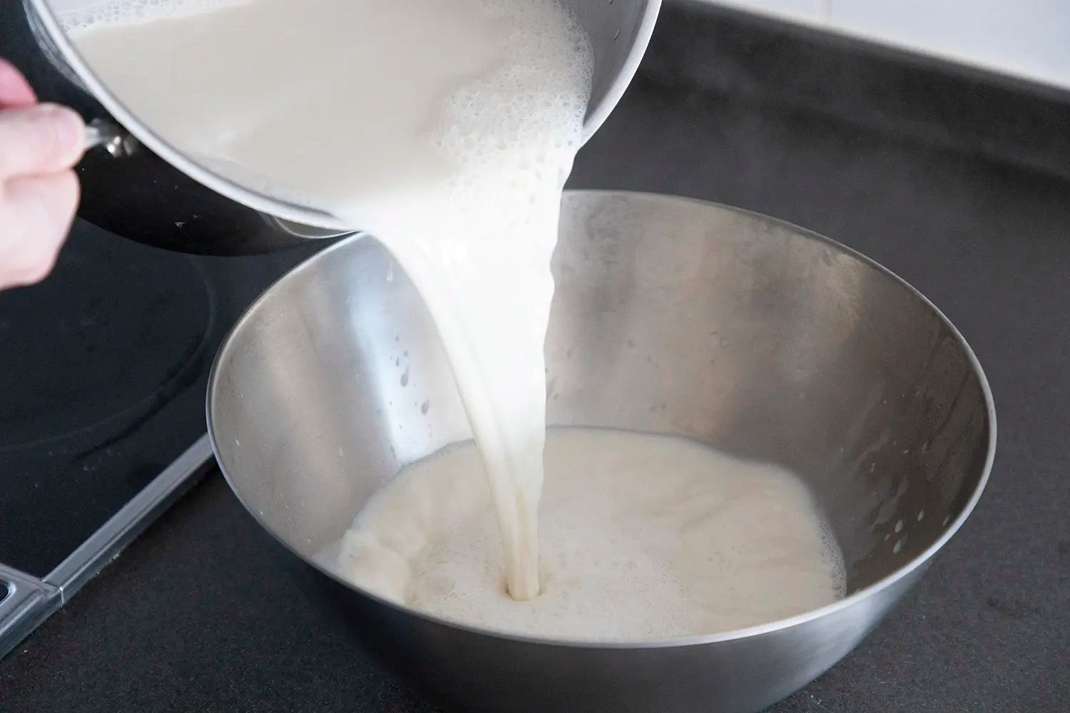 Transferring milk to bowl