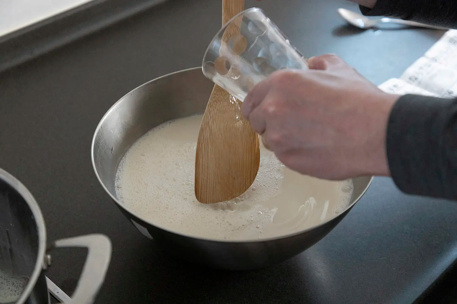 Pouring Nigari into milk