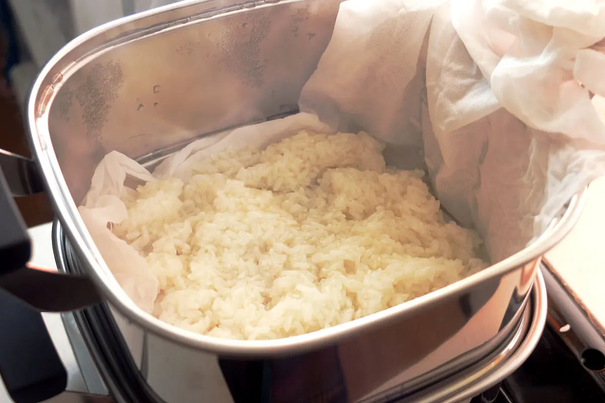 Place back the mochi rice in the steamer and steam it again in medium heat for about 10 more minutes.