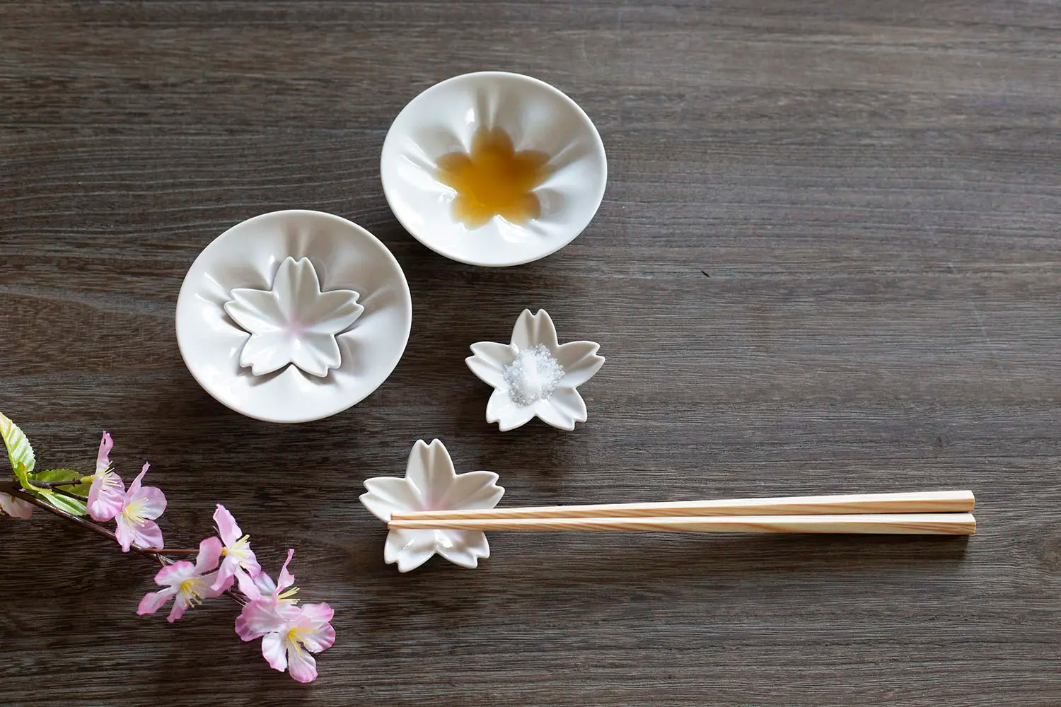 hiracle Sakura plates with sauces and used as chopstick rests.