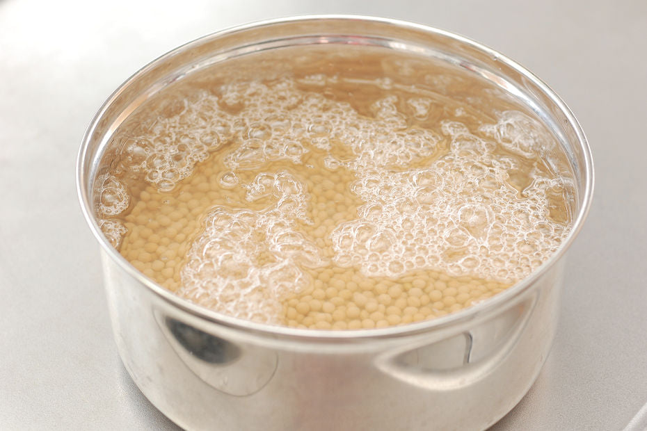 Soak dried soybeans in water