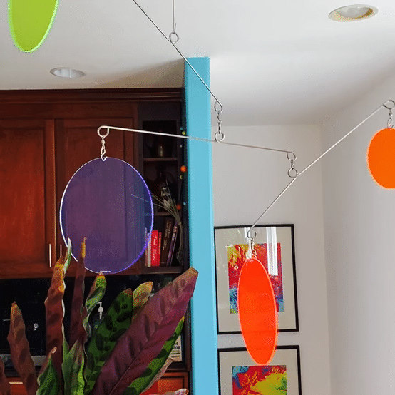 Animated gif of The Atomic Mobile in vibrant glowing fluorescent colors - hanging art mobiles by AtomicMobiles.com