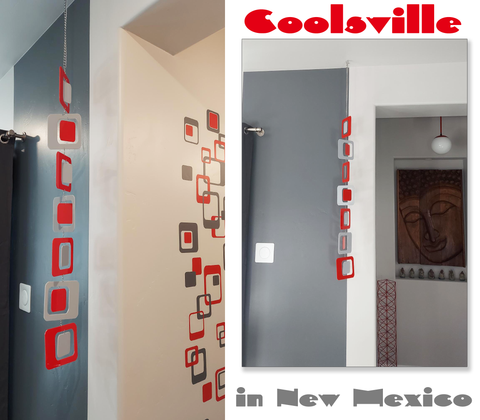Coolsville hanging art mobile in red and gray in customer in New Mexico's home by AtomicMobiles.com