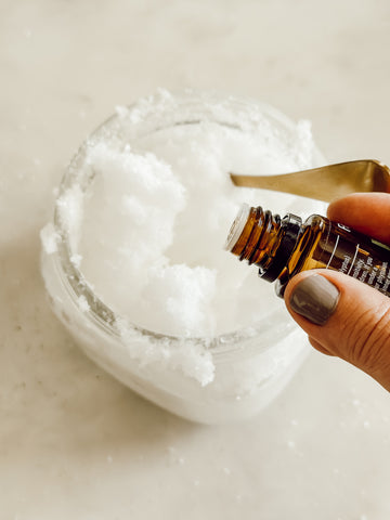 Coconut Oil Salt Scrub adding essential oils