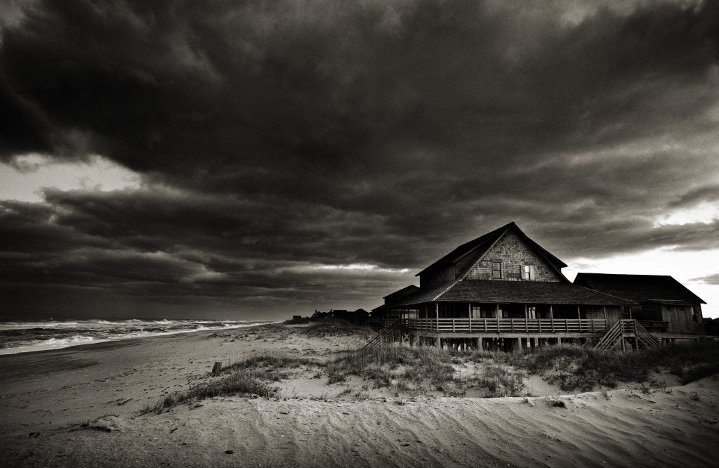 Moody black and white photograph of clouds over the beach in outer banks, North Carolina