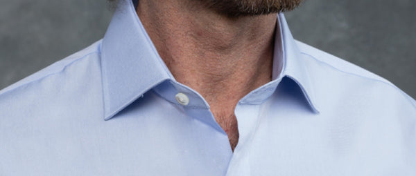 man wearing blue dress shirt