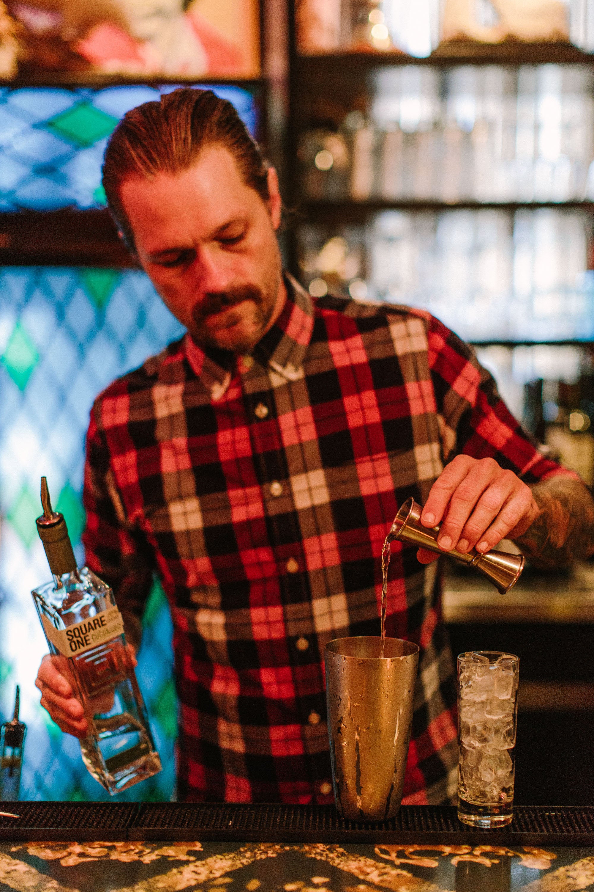 Richmond, Virginia bartender making a gin cocktail in a bar