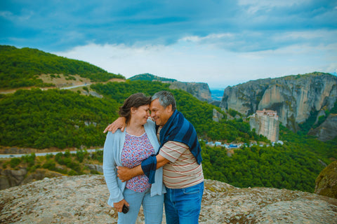 A happy older couple in the mountains.