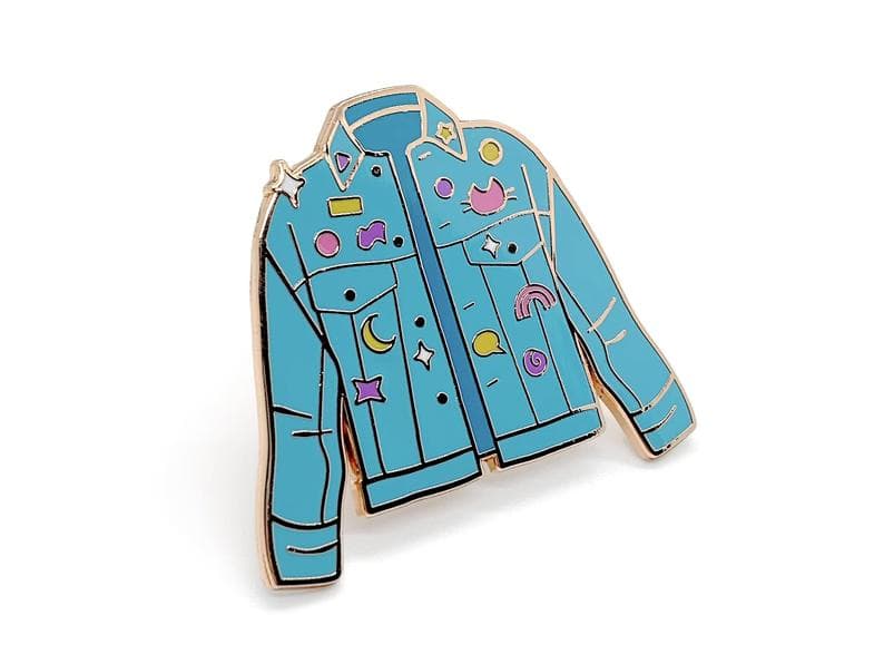 Enamel pin shaped like a jean jacket