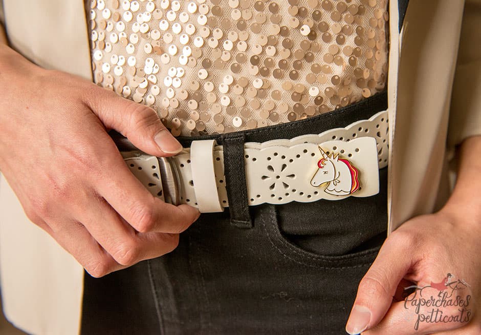 Belt with an enamel pin attached