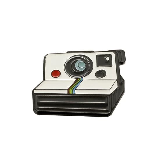 enamel pin shaped like a polaroid camera