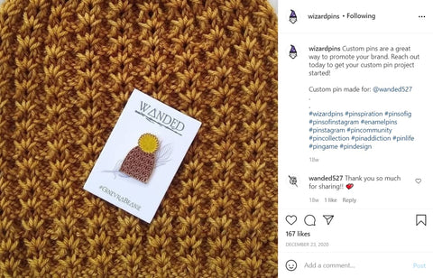 Screenshot of an Instagram Post with a hat-shaped enamel pin