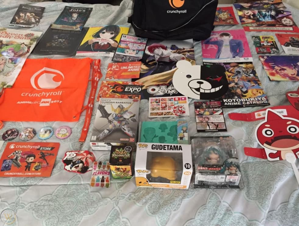 The swag from a Crunchyroll swag bag spread out