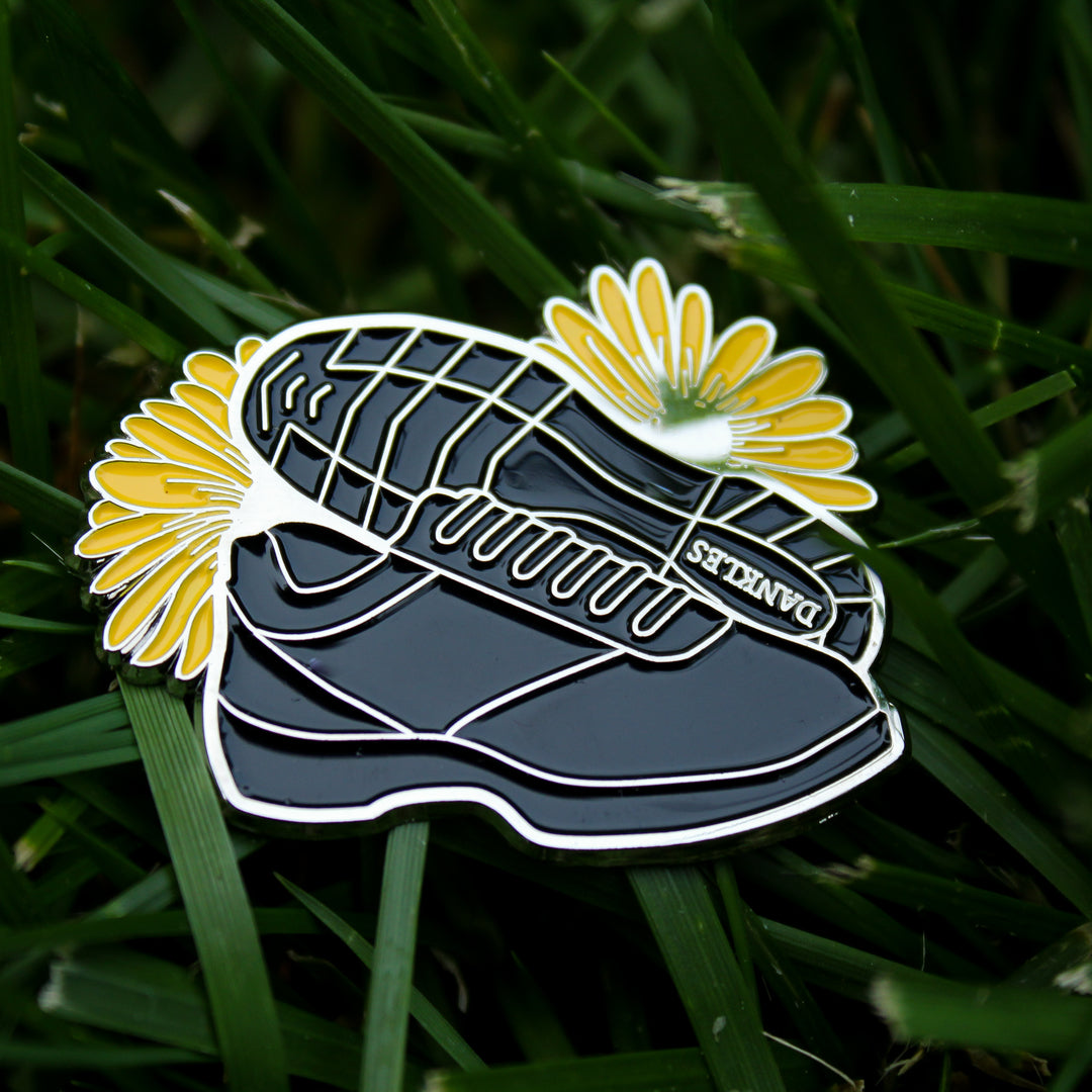 Black sneaker enamel pin with flowers
