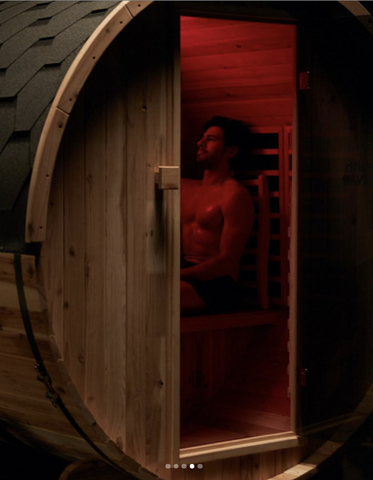 man relaxing in an infrared sauna