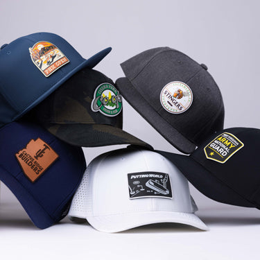 Custom polo and hats stacked