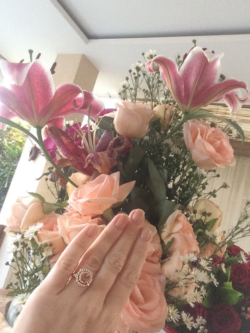 Pretty padparadscha ring in rose gold with double diamond halo