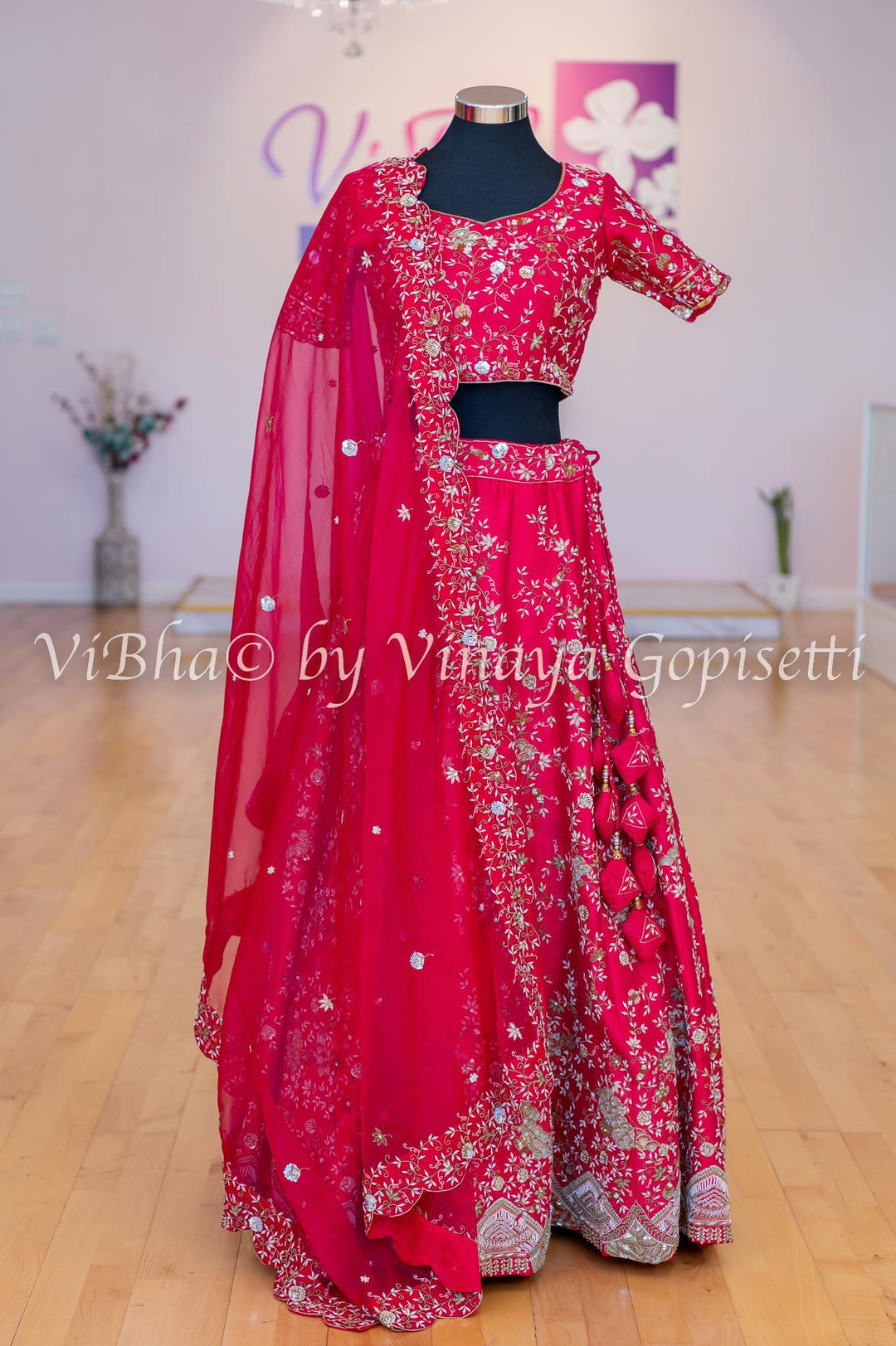 Pop pink embroidered raw silk peplum top with orange net kalamkari  embroidered lehenga