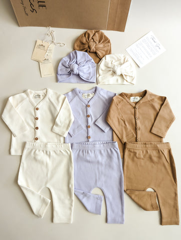 Organic baby clothes, shopify store, small business ideas, baby flatlay photography, baby product display, our story ideas