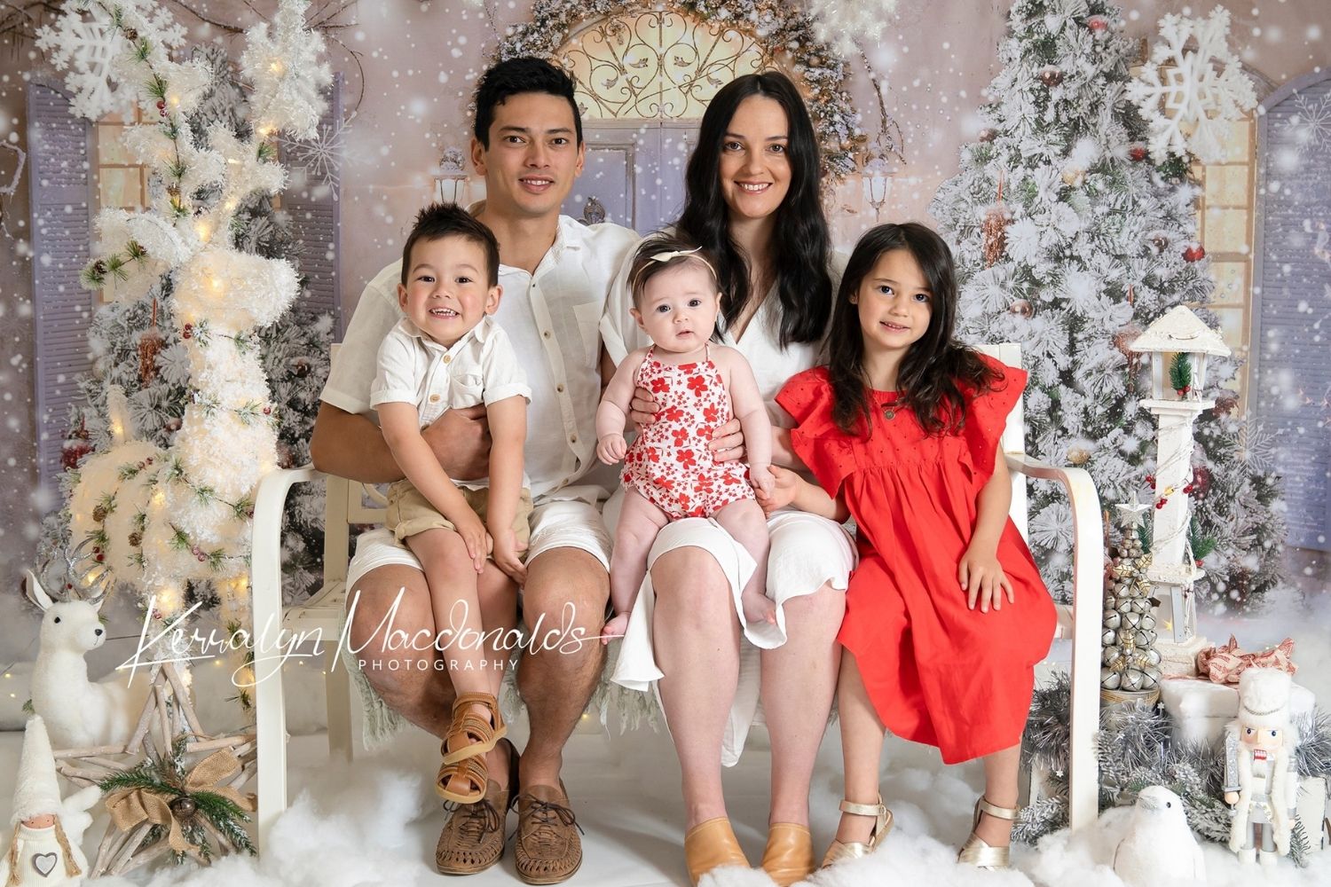 family photo by sitting on a couch with Kate Christmas Door Front Snow Backdrop for Photography