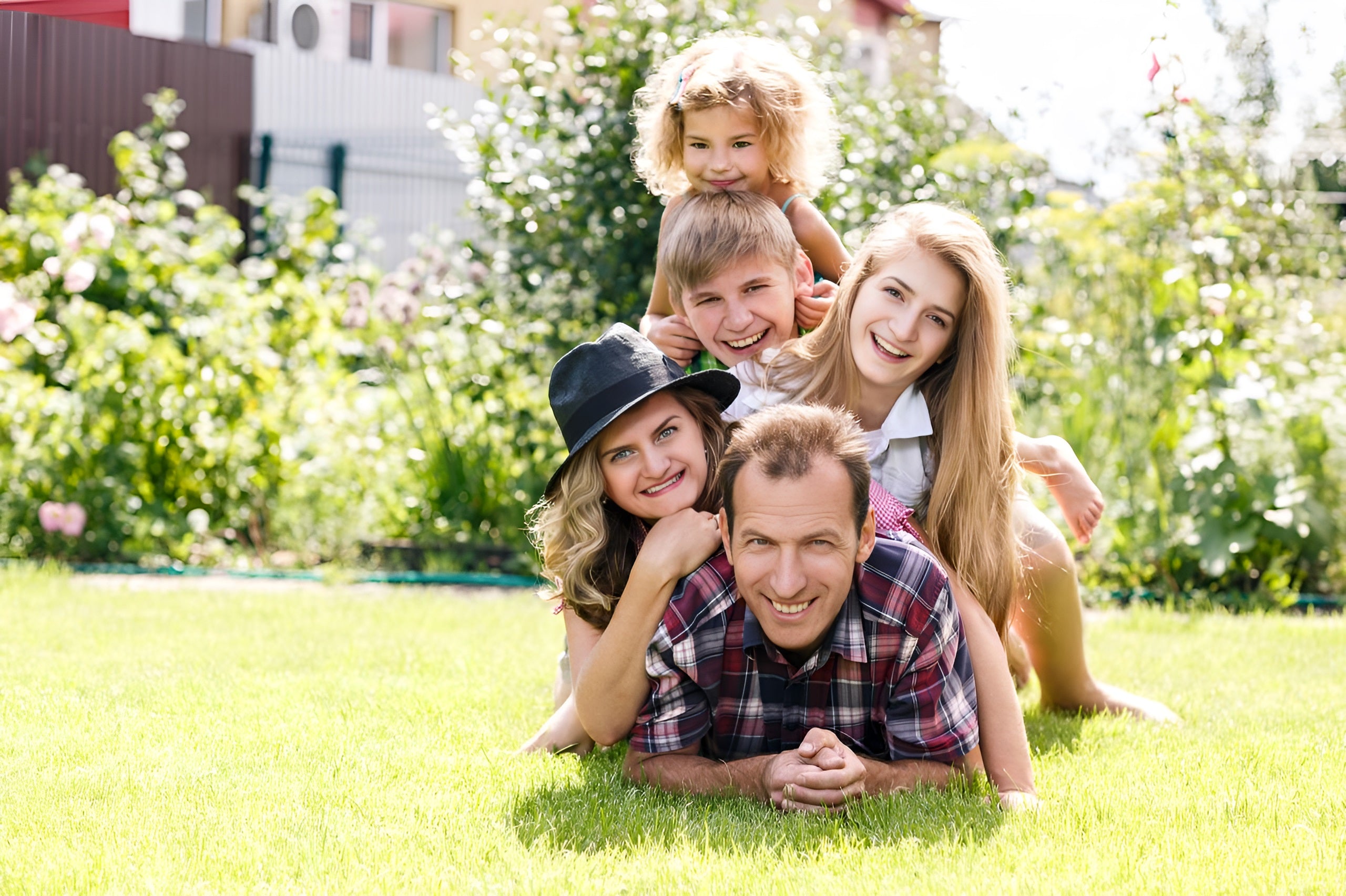 A family poses like a sandwich