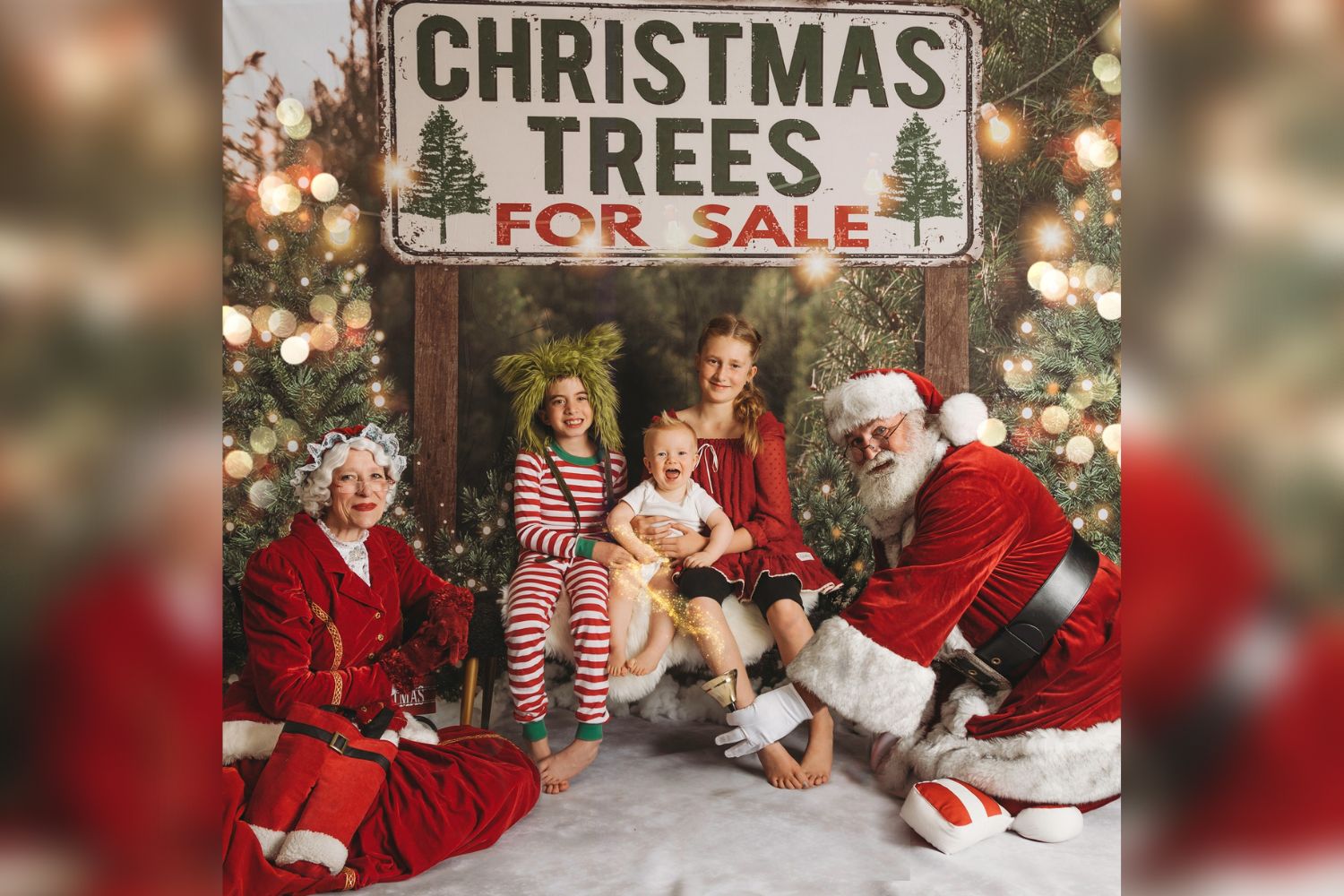 siblings taking Christams photo with Santa under Christams tree